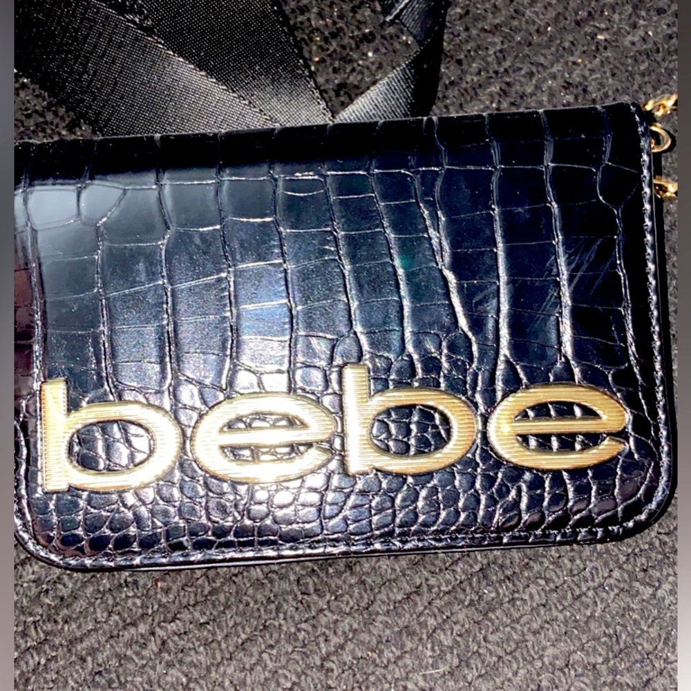 I am selling a BEBE Fabiola stamped croco small new black color crossbody